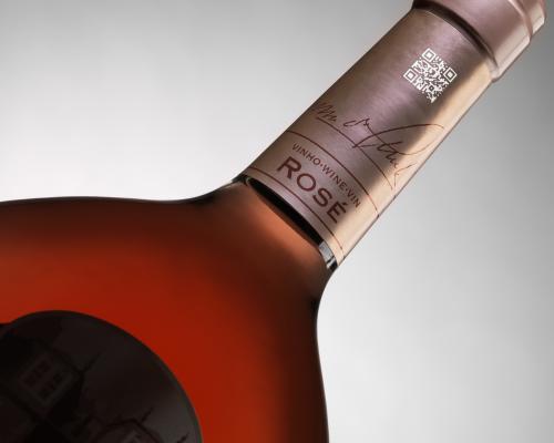 Laser coding on glass beverage bottles, providing permanent and precise markings for branding and traceability.