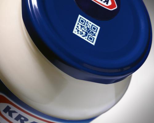 Equipment marking batch numbers and expiry dates on food packaging for traceability.