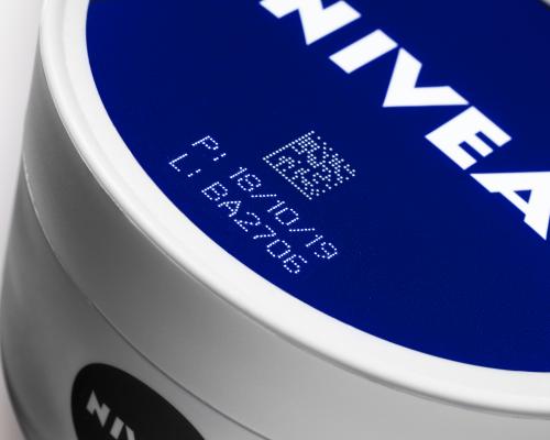 3D laser marking on irregularly shaped cream jars for branding and traceability.